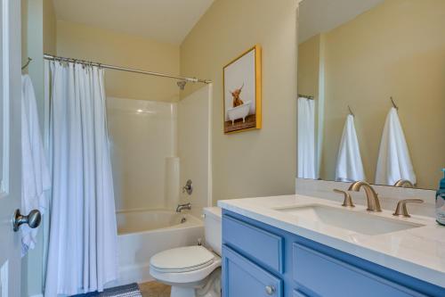 a bathroom with a sink and a toilet and a bath tub at Greensboro Condo Rental Near Hospital and Trails! in Greensboro