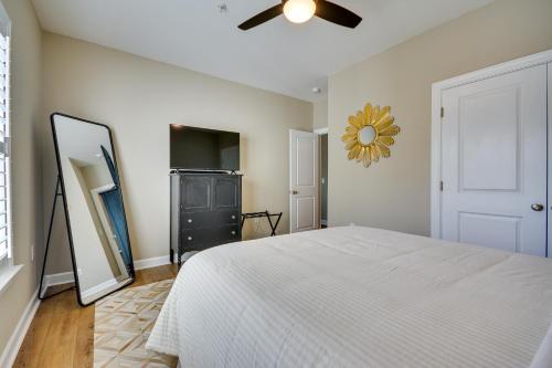 a bedroom with a bed and a ceiling fan at Greensboro Condo Rental Near Hospital and Trails! in Greensboro