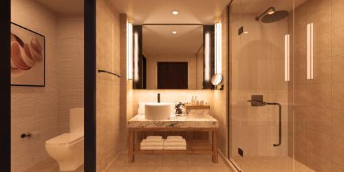 a bathroom with a sink and a toilet and a shower at Nobu Hotel at Caesars Atlantic City in Atlantic City