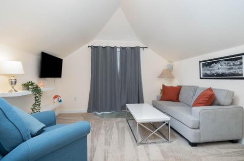 a living room with a couch and a table at Wallingford Oasis in Seattle