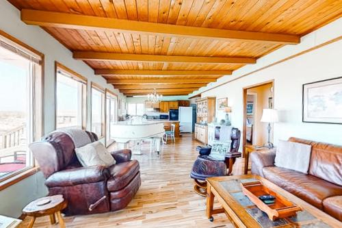 a living room with a couch and a table at Sea Mist in Rockaway Beach