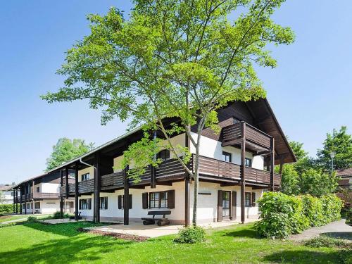 a building with a tree in front of it at Apartment in Neuschönau near Bavarian Forest in Neuschönau