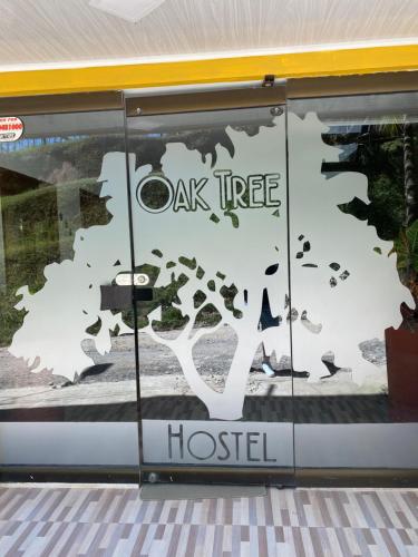 a oak tree hospital sign in a window at Oak Tree house in Guatapé