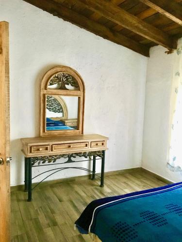 a dressing table with a mirror on top of it at Eco cabaña in Tepoztlán
