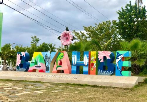 a sign that says hello in colorful graffiti at Sol Caribe 101 Bayahibe con linda piscina! in Bayahibe