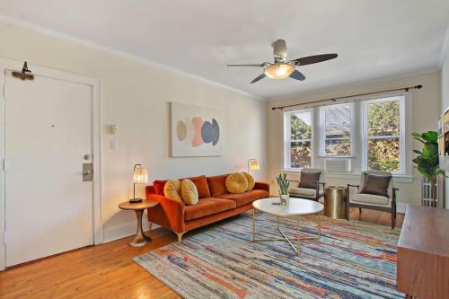a living room with a couch and a table at Ideal, Spacious & Furnished 1BR Apartment - Cullom C2 in Chicago