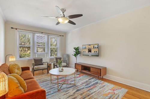 a living room with a couch and a table at Ideal, Spacious & Furnished 1BR Apartment - Cullom C2 in Chicago