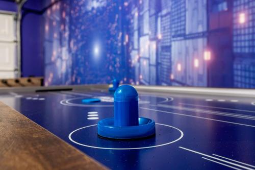 a ping pong table with blue balls on it at Private Heated Pool & Hot Tub, 4BR Gameroom in San Antonio