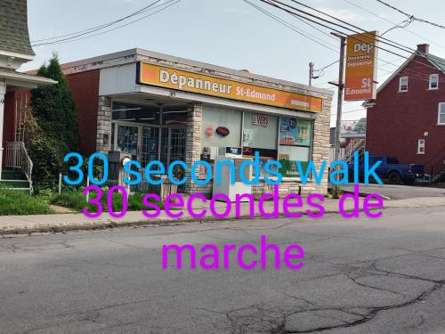 a store with a sign that reads second kids walk seconds ok at welcome to airbnb in Saint-Jean-sur-Richelieu