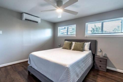 a bedroom with a bed and a ceiling fan at Roomy Urban Apartment Montrose! Free Parking #8 in Houston