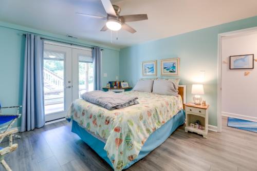 a bedroom with a bed and a ceiling fan at Emerald Isle Vacation Rental, Walk to Beach! in Emerald Isle