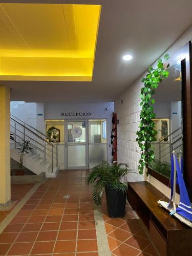 a lobby of a store with a yellow ceiling at HOTEL ARRECIFE in Santa Veronica
