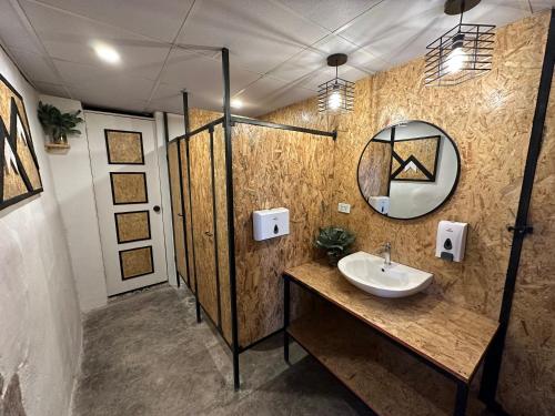 a bathroom with a sink and a mirror at CASA CRISTOBAL Siete Cuartones in Cusco
