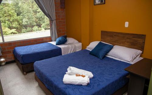 Postel nebo postele na pokoji v ubytování Hotel Valjala