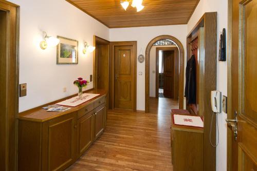 a room with a hallway with wooden floors and a room with a counter at Ferienhaus Birkenweg in Radstadt