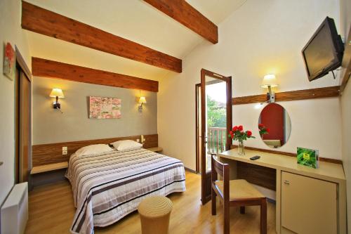 Ένα ή περισσότερα κρεβάτια σε δωμάτιο στο Le Clos Grand