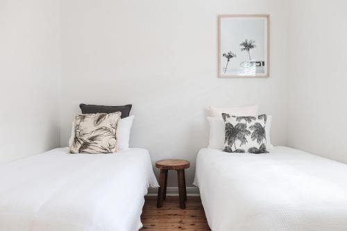 two beds sitting next to each other in a room at No 3 ShoalHaven in Shoal Bay