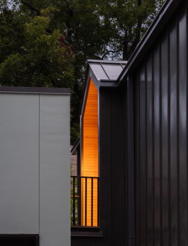 a black and white house with an orange door at East Austin Modern Bungalow in Austin