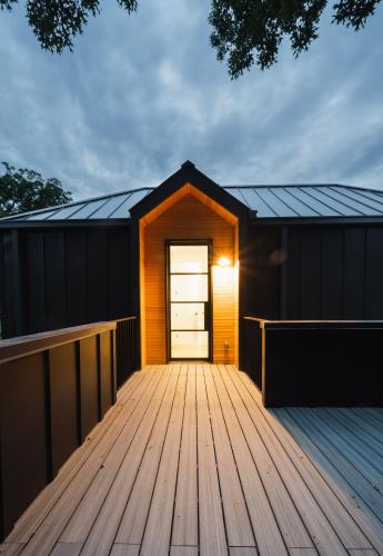 a small cabin with a wooden deck at East Austin Modern Bungalow in Austin