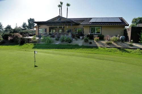 a house with a golf ball on the green at Cottage On The Greens - Studio in Poway