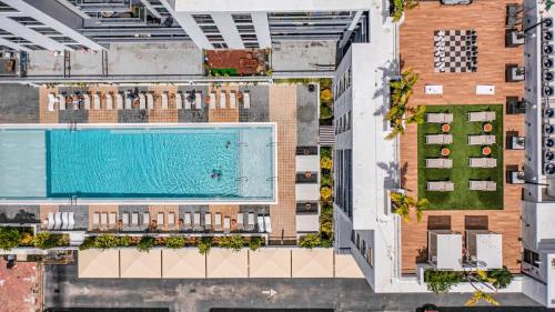 an overhead view of a building with a swimming pool at Wonderful Unit In Downtown Miami With Free Parking in Miami