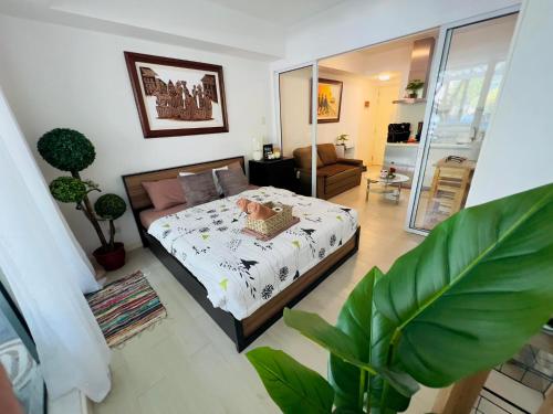 a bedroom with a bed in a room at Beach Front Living in the Heart of the City, AZURE Residences in Manila