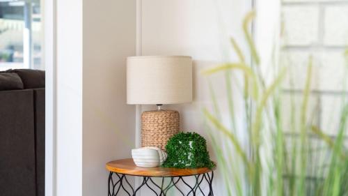 a lamp on a table in a living room at Anchorage in Greenwell Point