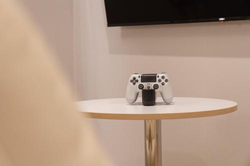 a video game controller sitting on top of a table at Cheonan Aank Hotel Seongjeong in Cheonan