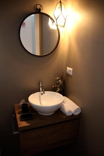 a bathroom with a sink and a mirror on the wall at Nest House & Relax in Civitanova Marche