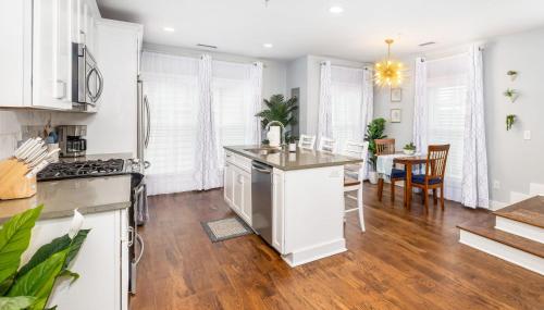 an open kitchen and dining room with a table at Secluded Courtyard & Parking - 2 Blocks to King in Charleston