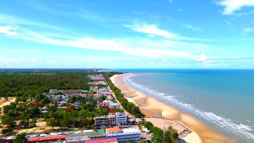 an aerial view of a beach and the ocean at Beachfront Apartment with Balcony, Sea View & Pool View - Cha Am - Hua Hin in Ban Pak Khlong Cha-am
