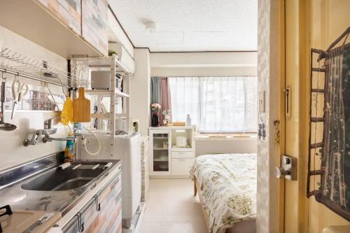 Ένα ή περισσότερα κρεβάτια σε δωμάτιο στο TOKYO Secret house 201