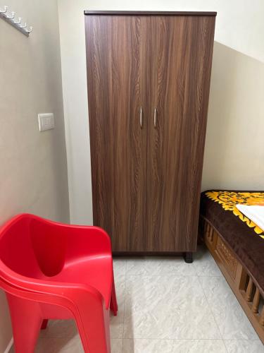 Postel nebo postele na pokoji v ubytování Jothi Residency