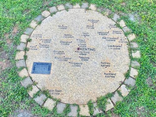 a stone circle in the middle of the grass at 墾丁勿忘我城堡莊園 in Hengchun