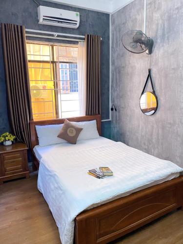 Ένα ή περισσότερα κρεβάτια σε δωμάτιο στο Amy Hostel Hue