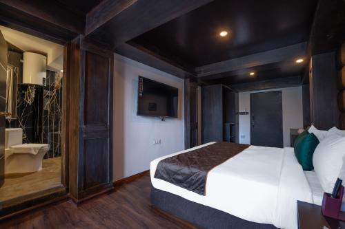 Cama o camas de una habitación en The West Gate Posada By Summit