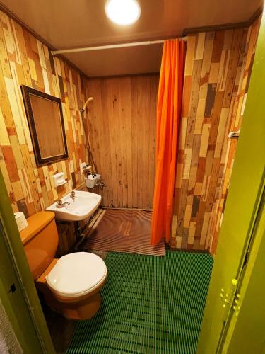 a bathroom with a toilet and a sink at Doobaki Hostel in Gyeongju