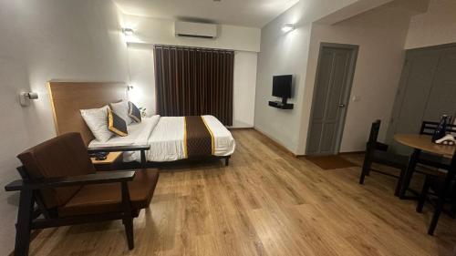 Postel nebo postele na pokoji v ubytování Hotel B R REGENCY