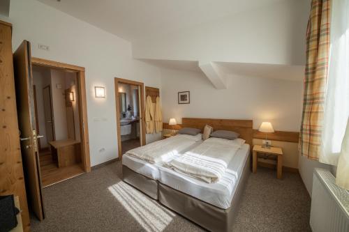 Ένα ή περισσότερα κρεβάτια σε δωμάτιο στο Pöder - daheim in den Bergen