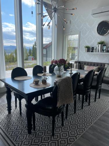 a dining room with a table and chairs at Ottsjö-Åre Lodge in Ottsjö
