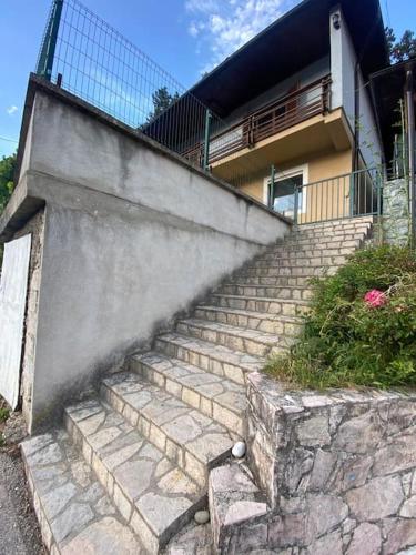 a set of stone stairs in front of a house at Apartman Jerkovic in Konjic