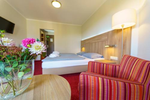 Voodi või voodid majutusasutuse Einklang - Dein Hotel am Südhorn toas