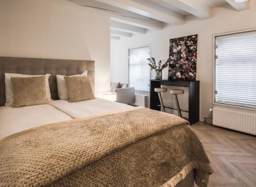 Postel nebo postele na pokoji v ubytování Le Bon'Apart Suites