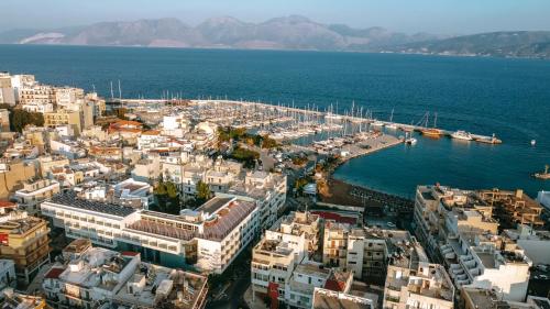 an aerial view of a city with a marina at Santa Marina Unique Hotel in Agios Nikolaos