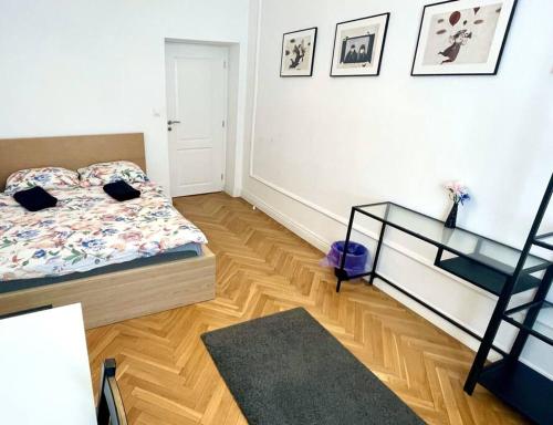 a bedroom with a bed and a staircase in it at Fantastic - KP69 Room D in Warsaw