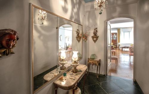 a dressing room with a mirror and a table at Vintage apartment KOLONAKI in Athens