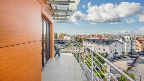 a balcony with a view of a city at Foka, Sun & Snow in Hel