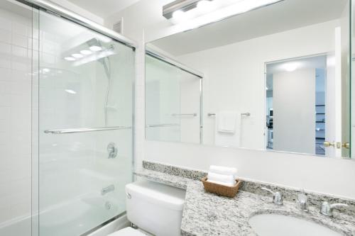 a bathroom with a toilet and a shower and a sink at River N 2BR w Gym WD nr Magnificent Mile CHI-164 in Chicago