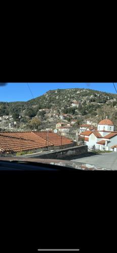 a view of a town with a mountain in the background at The Small Mountain house in Séta