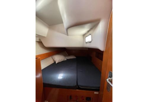 a small bed in the middle of a boat at S Odyssey 21032i in Corfu
